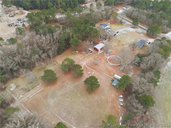 an aerial view of a house with a yard