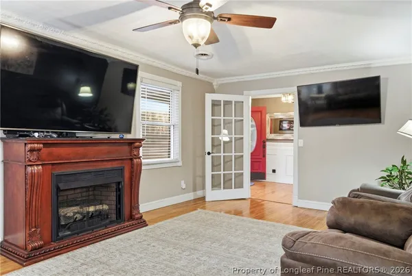 a living room with furniture and a flat screen tv
