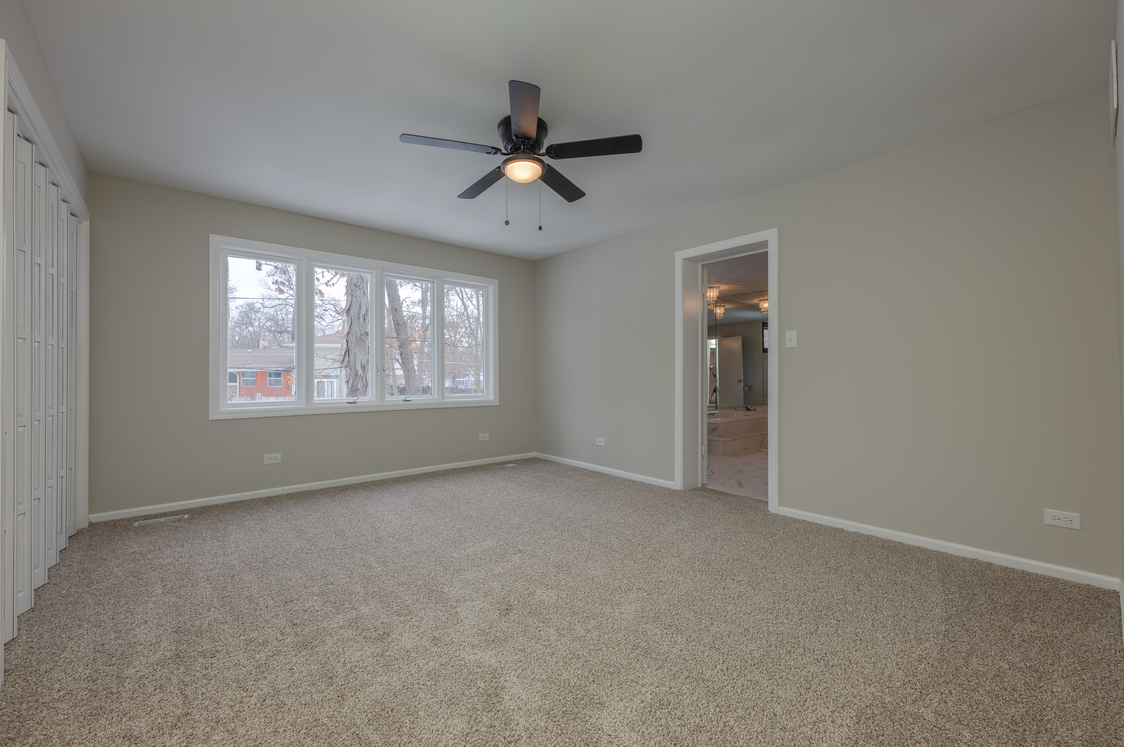 129 Cornwall Drive Crete, IL 60417 - Photo 26 of 52 an empty room with windows and fan