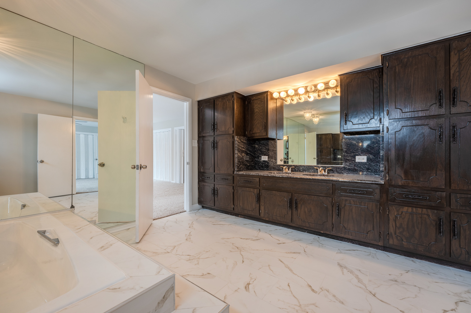129 Cornwall Drive Crete, IL 60417 - Photo 28 of 52 a large bathroom with a double vanity sink a mirror and a shower