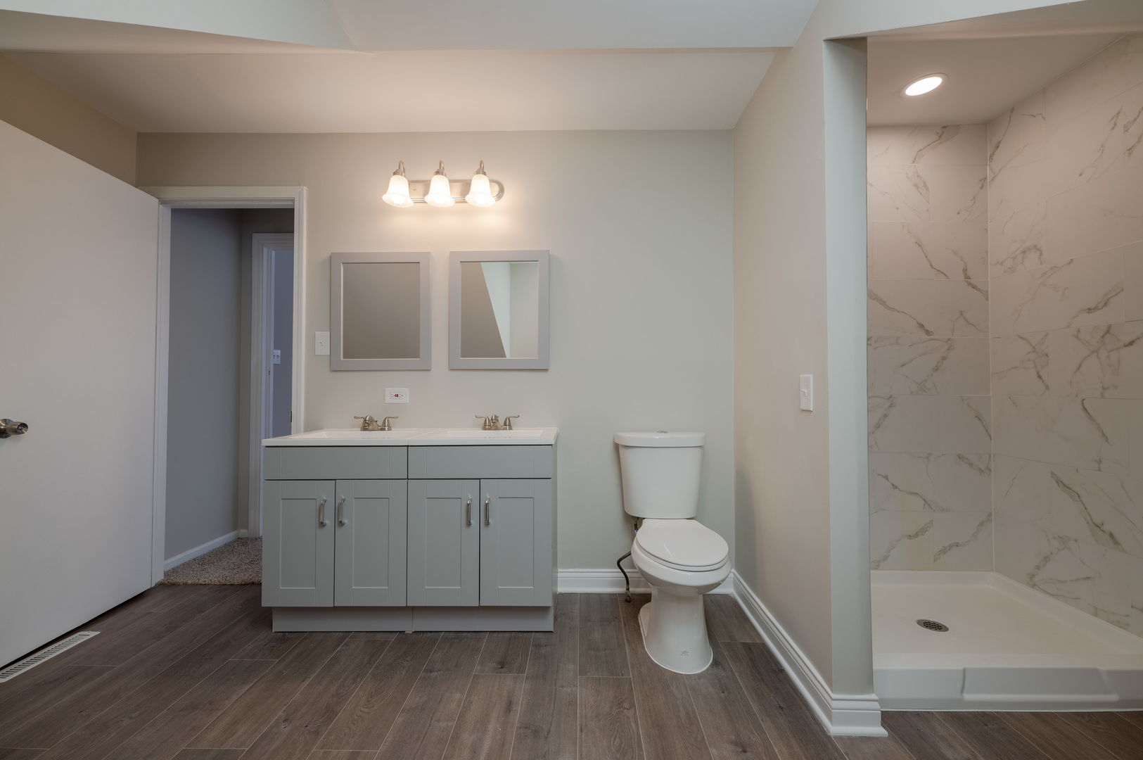 129 Cornwall Drive Crete, IL 60417 - Photo 32 of 52 a bathroom with a sink a toilet and shower