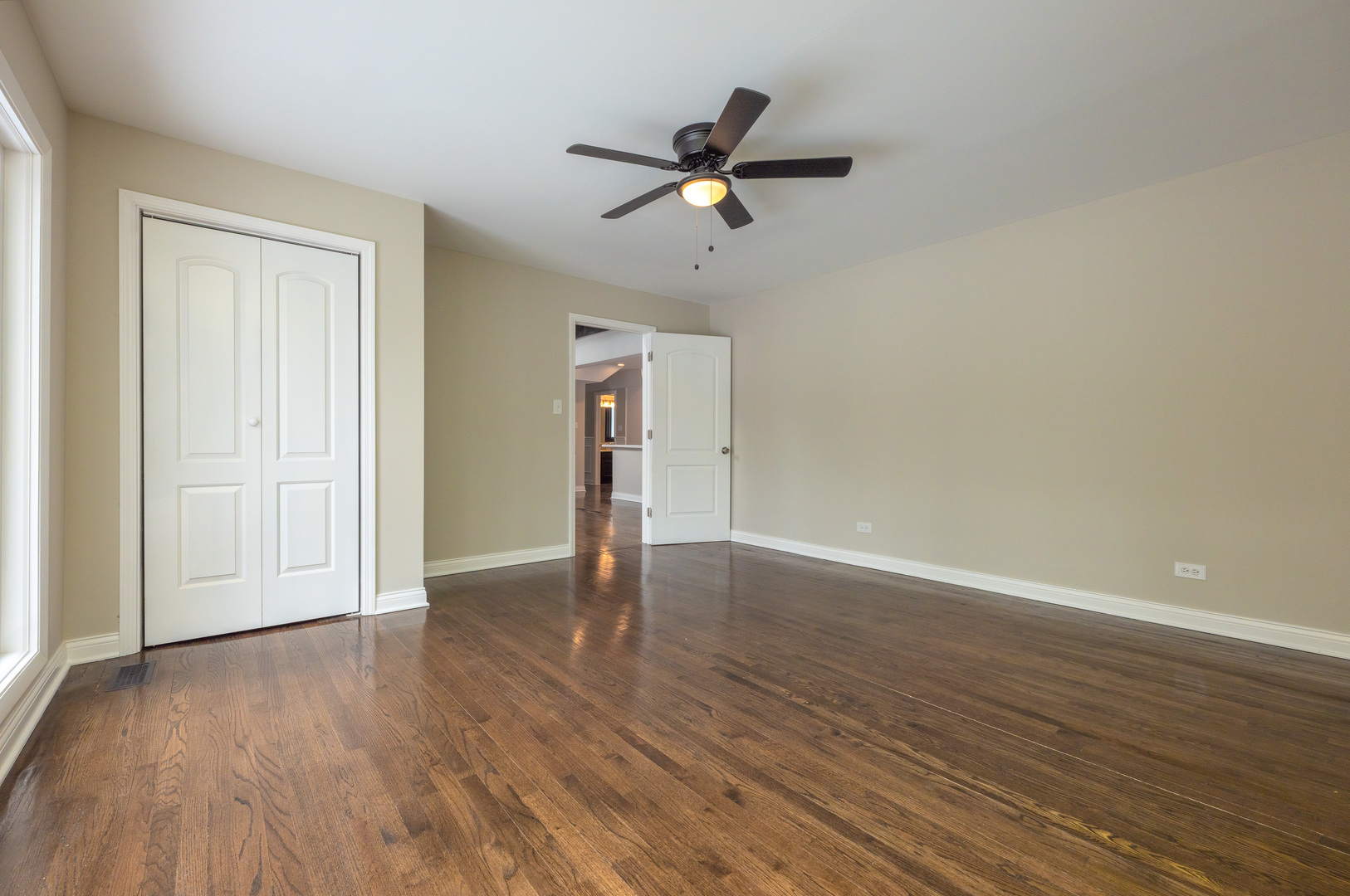129 Cornwall Drive Crete, IL 60417 - Photo 6 of 52 a view of an empty room with wooden floor