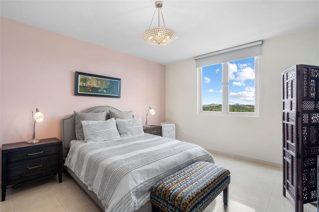1 Palma Real Avenue, Unit 2 A6 Guaynabo, PR 00969 - Photo 22 of 49 a bedroom with a bed and a window
