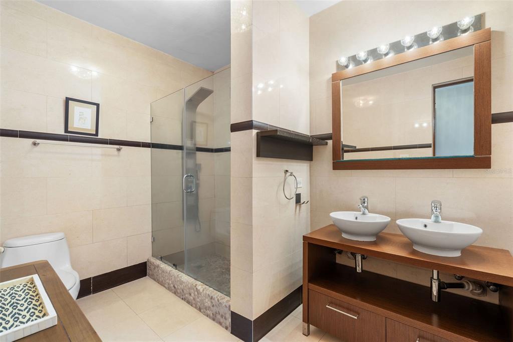 1 Palma Real Avenue, Unit 2 A6 Guaynabo, PR 00969 - Photo 23 of 49 a bathroom with a sink a mirror and a shower