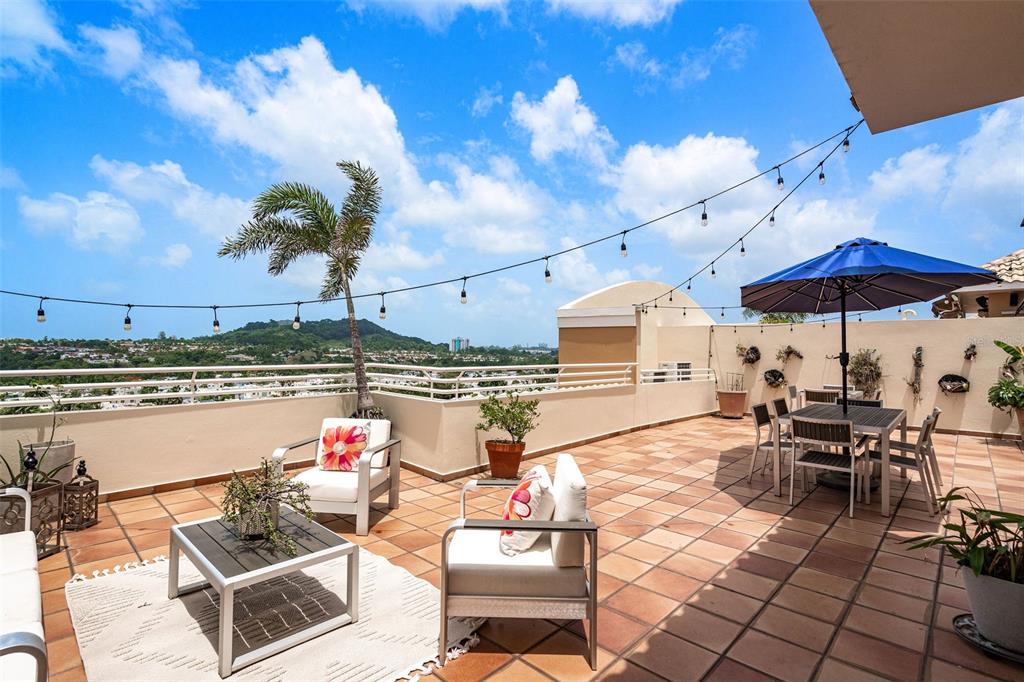 1 Palma Real Avenue, Unit 2 A6 Guaynabo, PR 00969 - Photo 34 of 49 a outdoor space with lots of tables and chairs