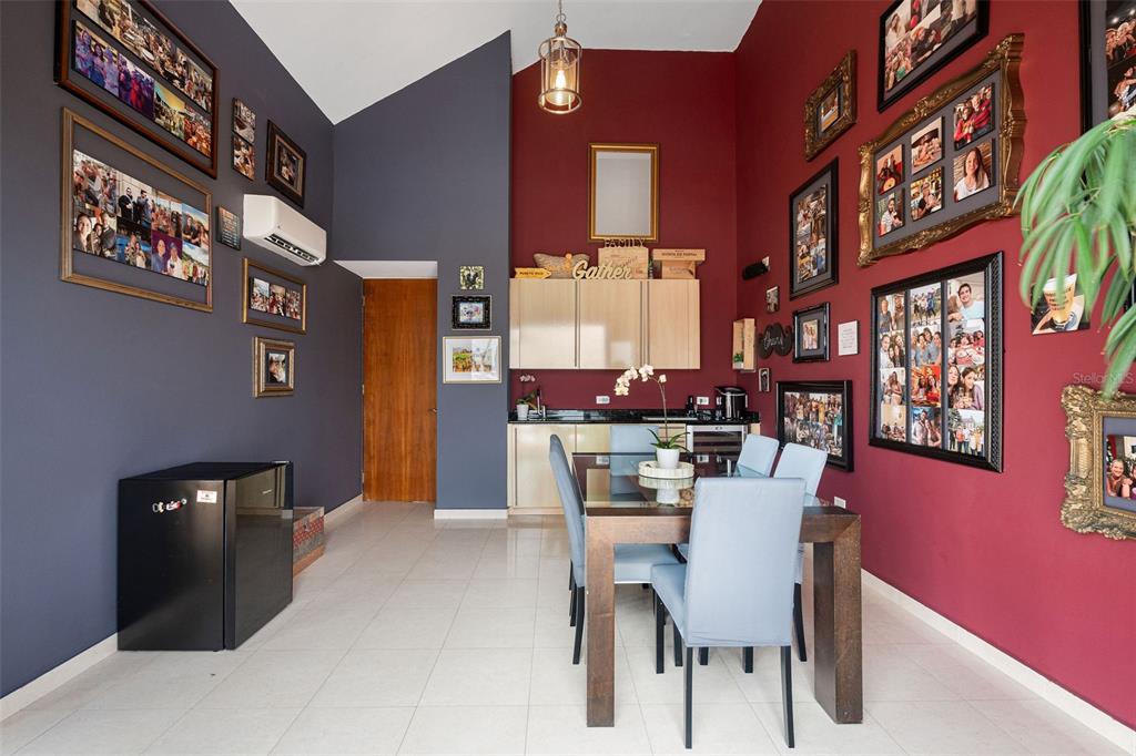 1 Palma Real Avenue, Unit 2 A6 Guaynabo, PR 00969 - Photo 41 of 49 a dining room with furniture and a floor to ceiling window
