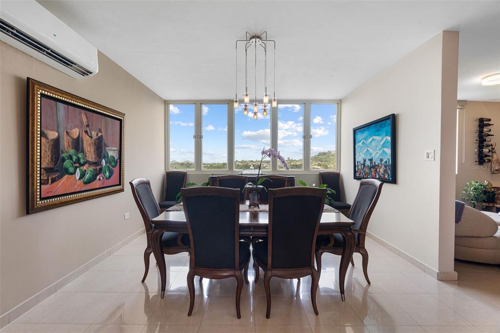 1 Palma Real Avenue, Unit 2 A6 Guaynabo, PR 00969 - Photo 10 of 49 a view of a dining room with furniture window and wooden floor
