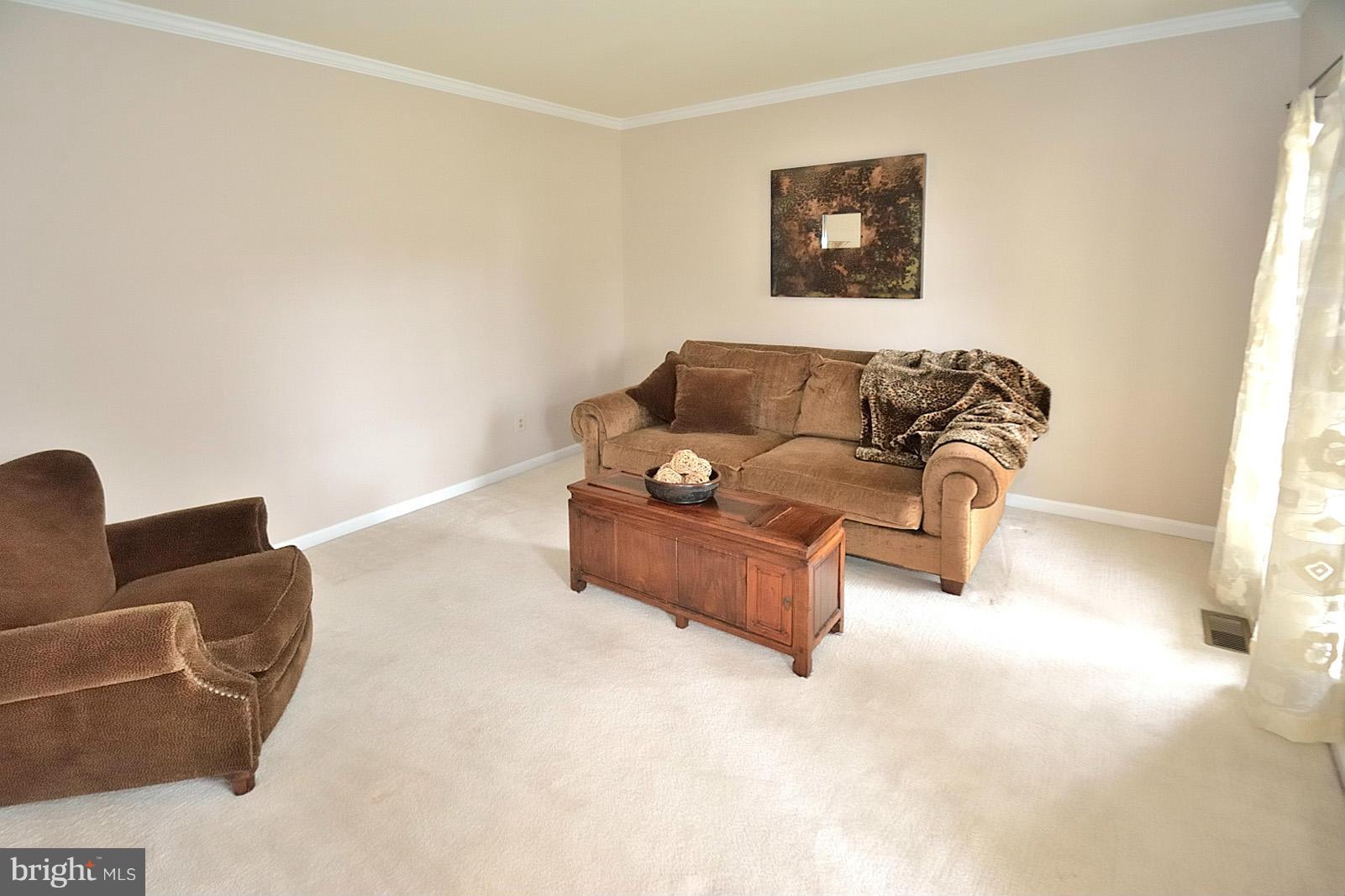 2303 Hurlingham Lane Reston, VA 20191 - Photo 14 of 30 a living room with furniture and a window