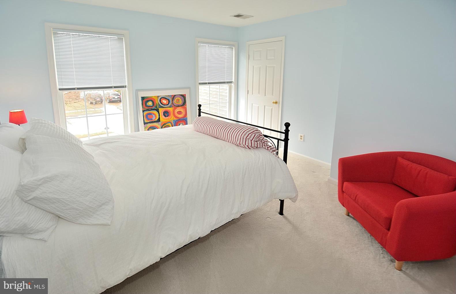 2303 Hurlingham Lane Reston, VA 20191 - Photo 22 of 30 a bedroom with a bed and a couch