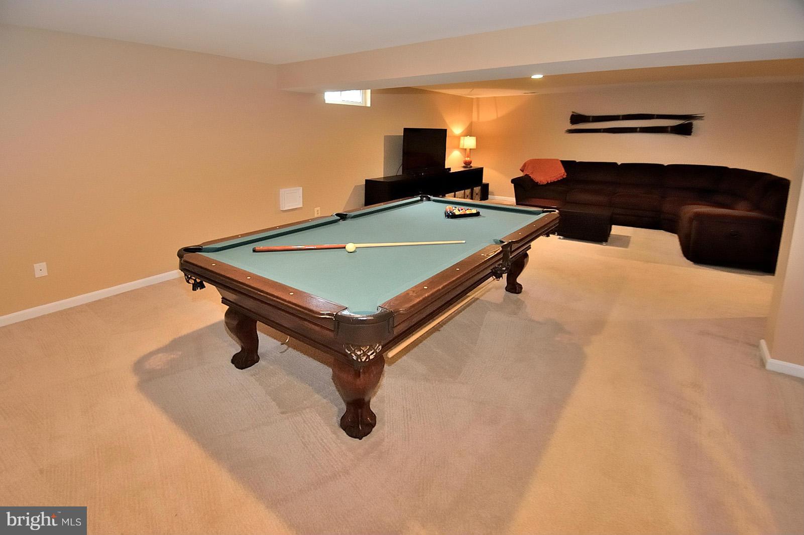 2303 Hurlingham Lane Reston, VA 20191 - Photo 24 of 30 a living room with furniture pool table and a flat screen tv