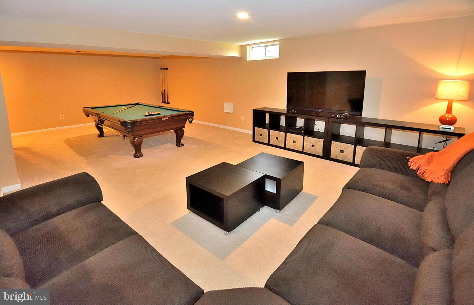 2303 Hurlingham Lane Reston, VA 20191 - Photo 25 of 30 a living room with furniture and a flat screen tv