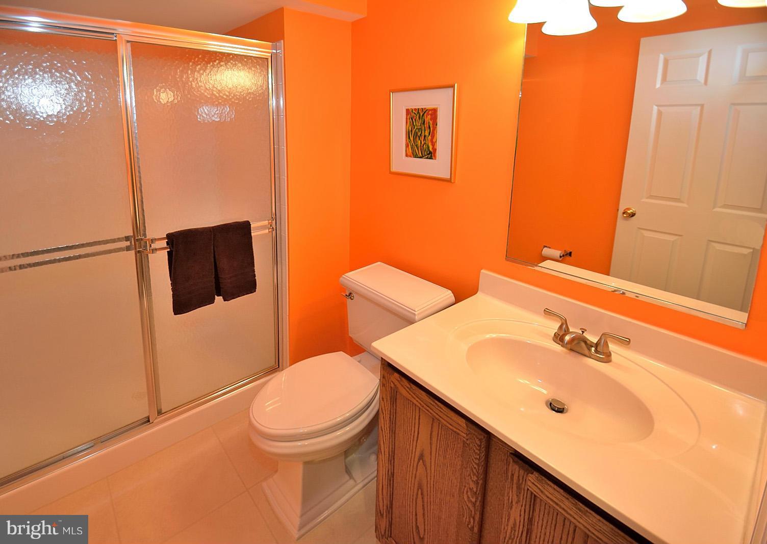 2303 Hurlingham Lane Reston, VA 20191 - Photo 26 of 30 a bathroom with a sink a toilet and shower