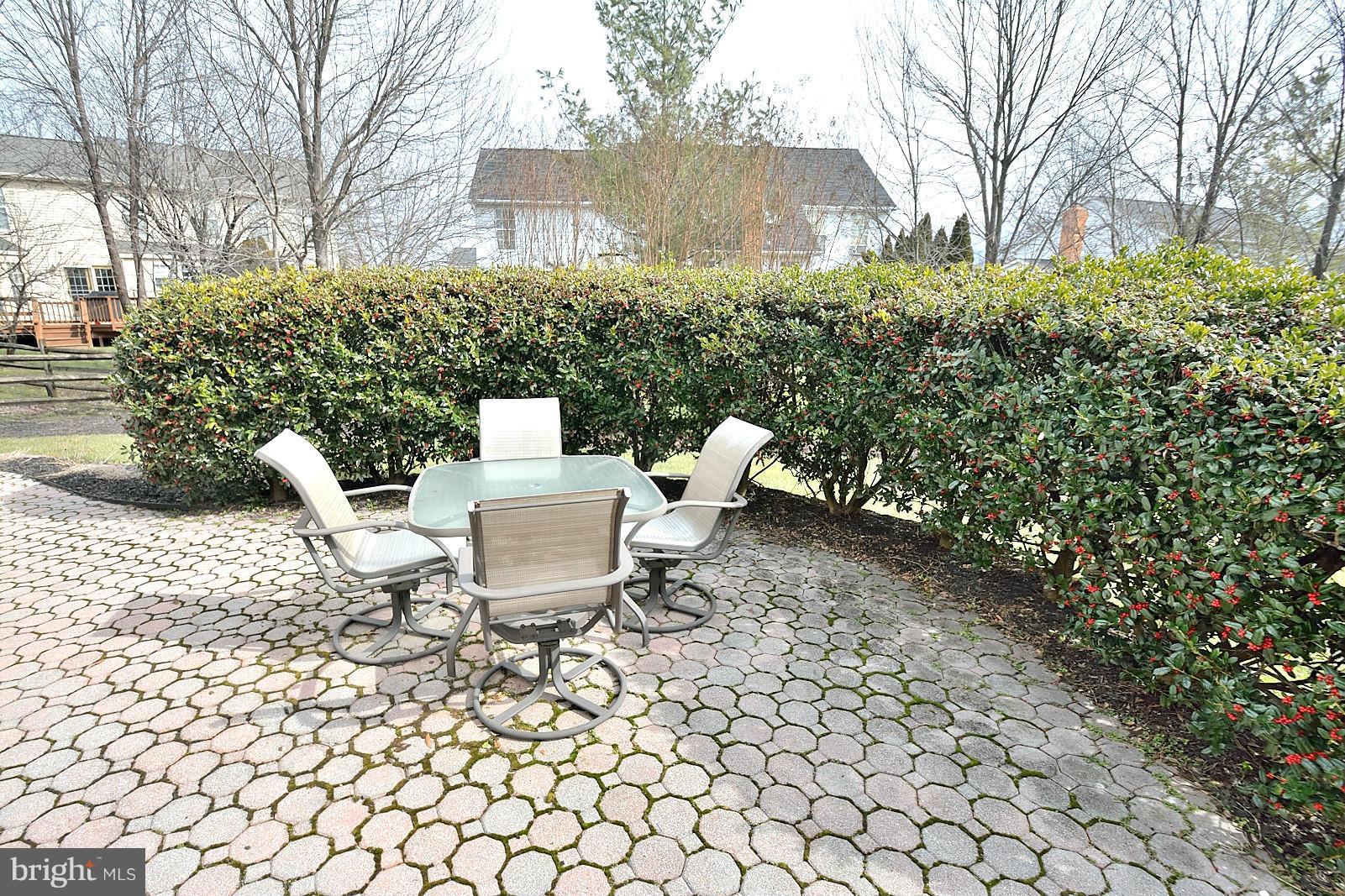 2303 Hurlingham Lane Reston, VA 20191 - Photo 28 of 30 a view of backyard of house with outdoor seating