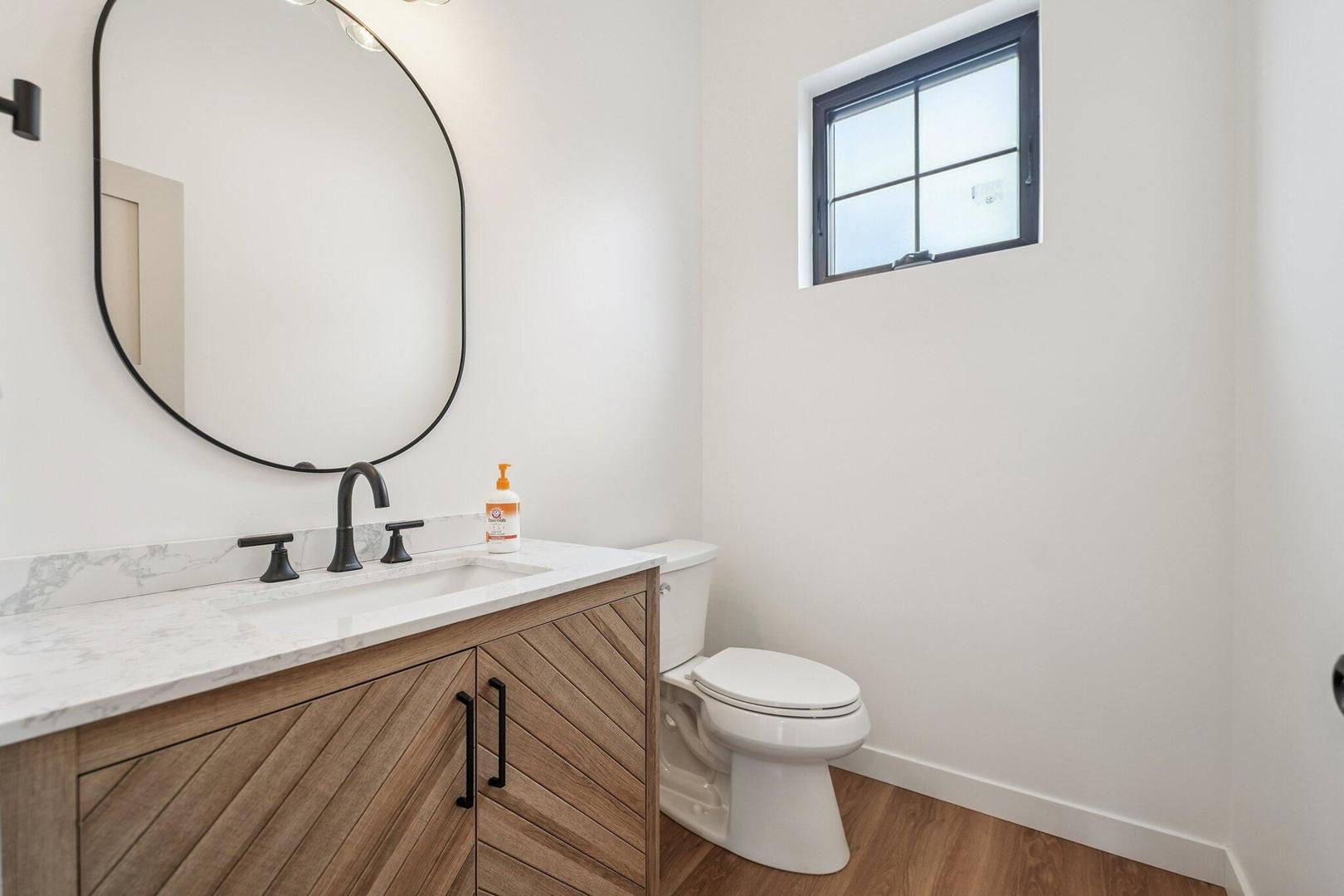 298 Apache Trail Lake In The Hills, IL 60156 - Photo 14 of 23 a bathroom with a toilet sink and mirror