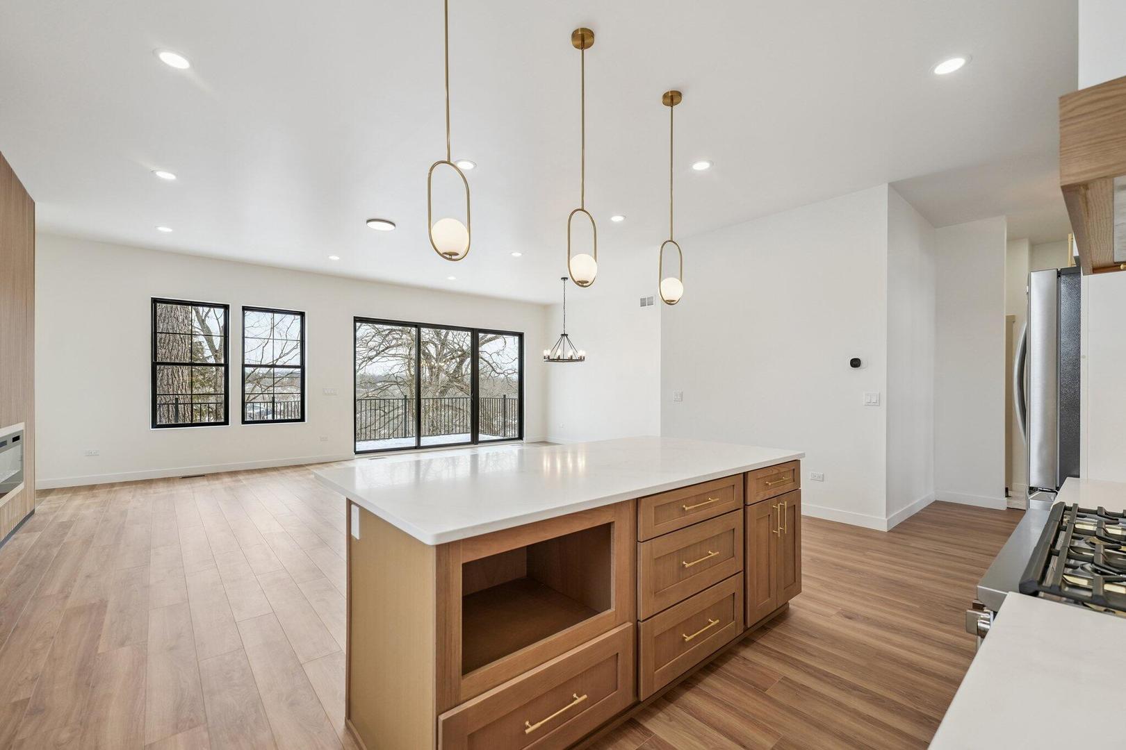 298 Apache Trail Lake In The Hills, IL 60156 - Photo 15 of 23 a kitchen with a wooden floor and window