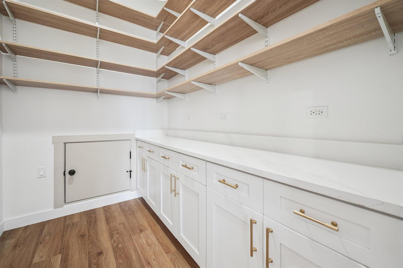 298 Apache Trail Lake In The Hills, IL 60156 - Photo 17 of 23 a view of a storage & utility room with wooden floor