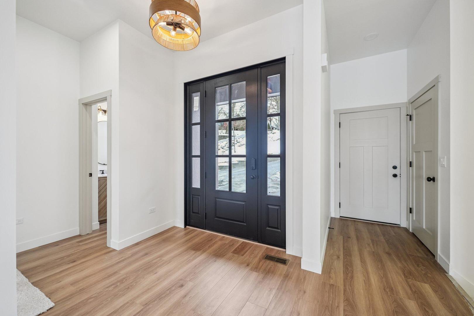 298 Apache Trail Lake In The Hills, IL 60156 - Photo 18 of 23 a view of an empty room with window and wooden floor