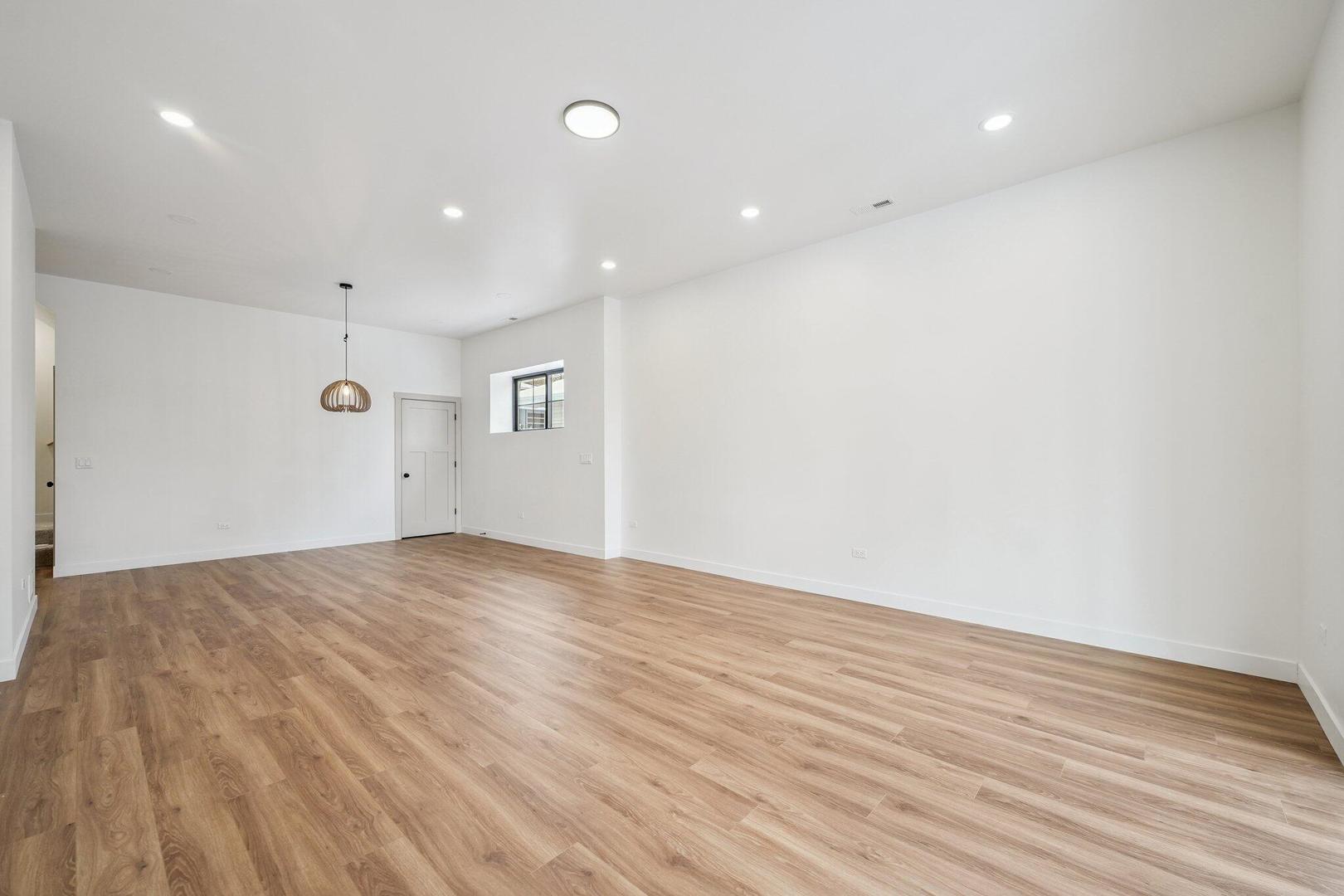 298 Apache Trail Lake In The Hills, IL 60156 - Photo 19 of 23 a view of empty room with wooden floor