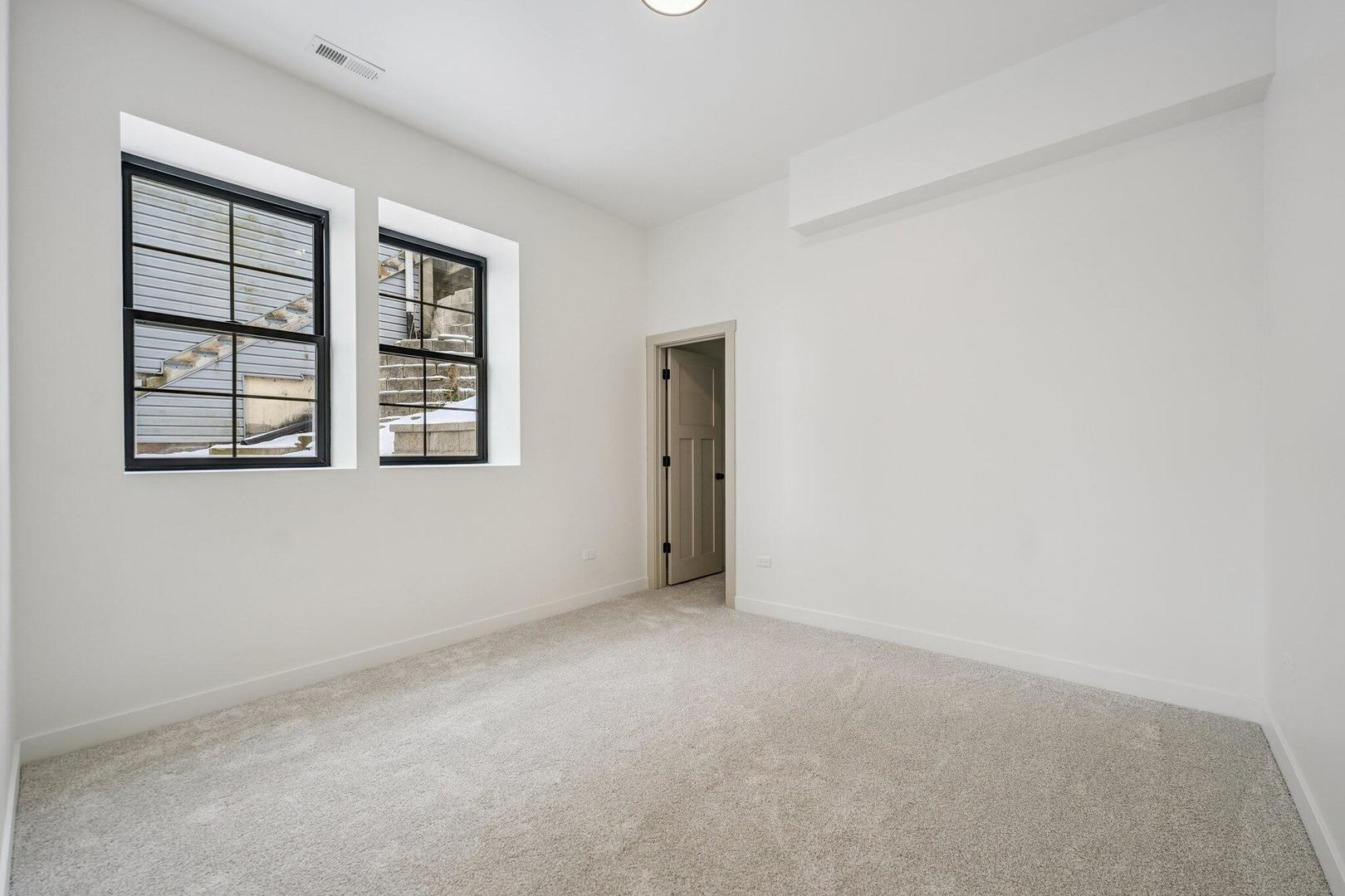 298 Apache Trail Lake In The Hills, IL 60156 - Photo 20 of 23 an empty room with windows