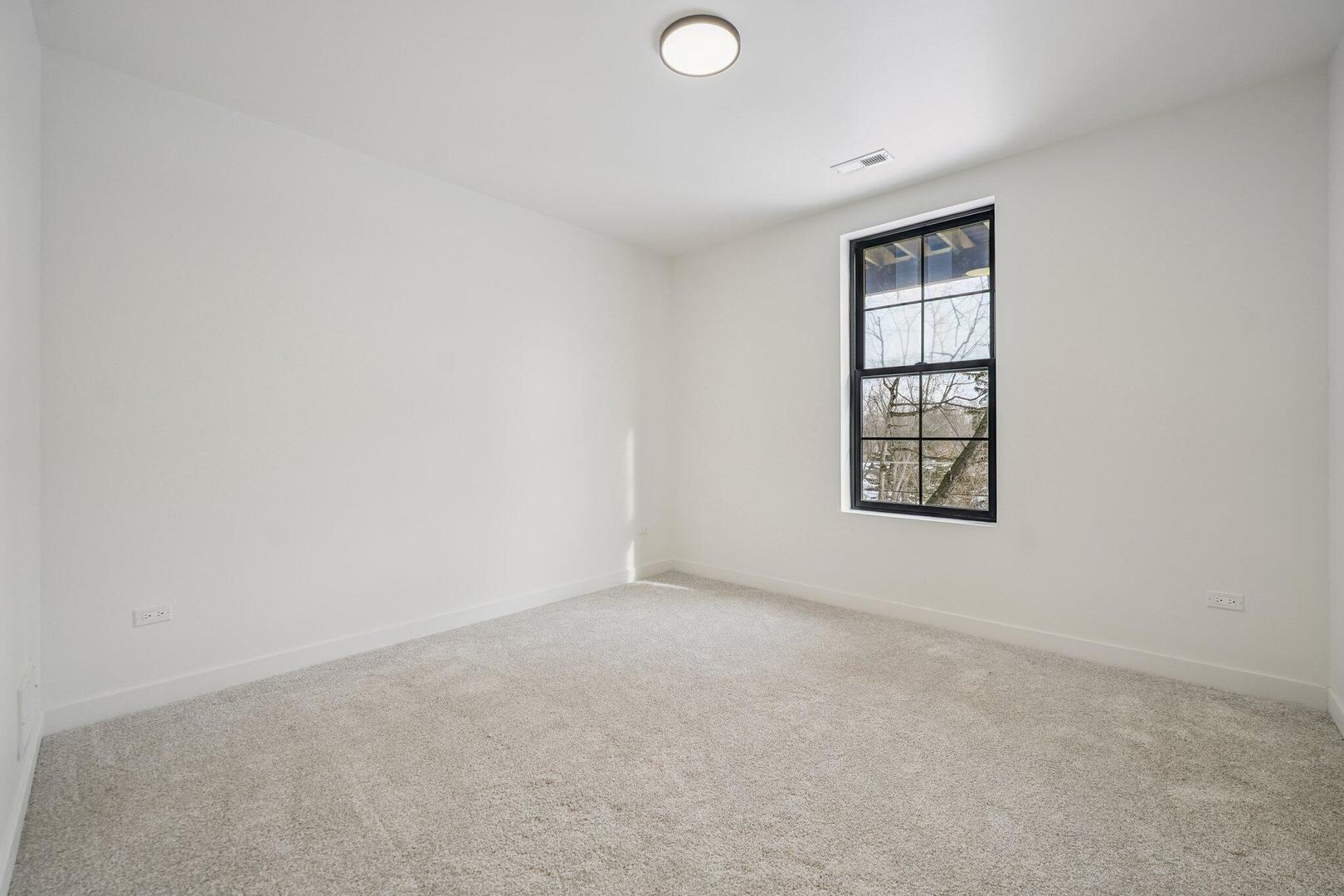 298 Apache Trail Lake In The Hills, IL 60156 - Photo 22 of 23 an empty room with windows
