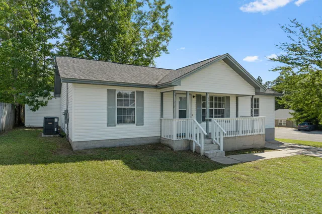 a front view of a house with a yard