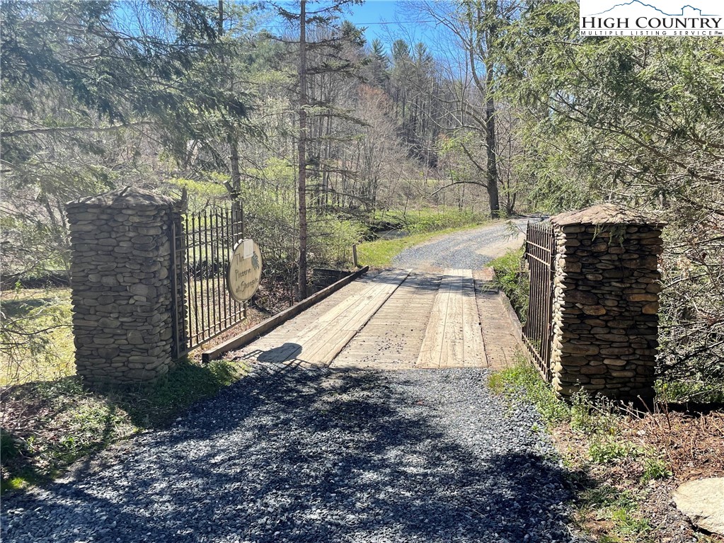 6 Stonegate Lane Creston, NC 28615 - Photo 22 of 22 a view of a yard with large trees