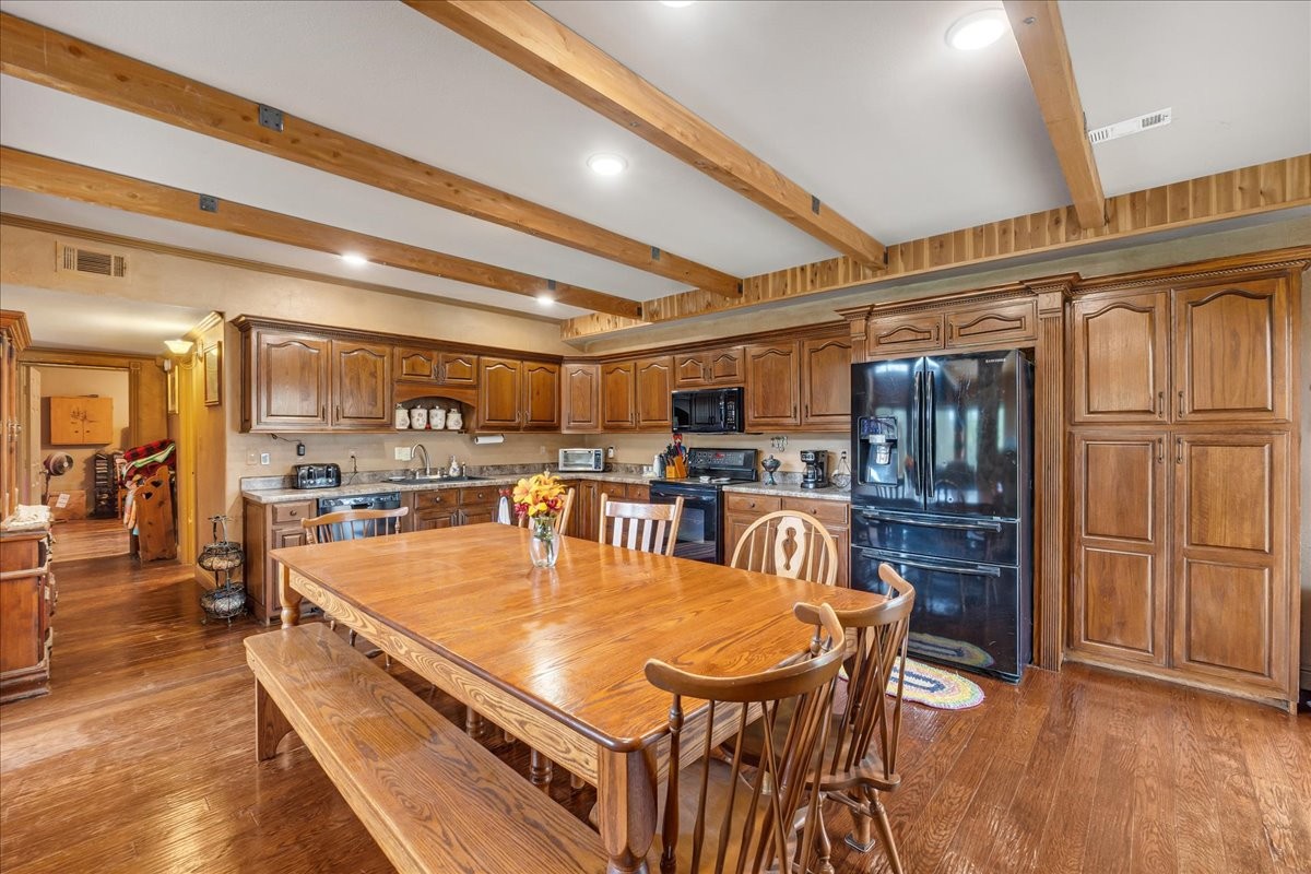 48 Mt Lebanon Road Lawrenceburg, TN 38464 - Photo 40 of 85 a dining table with chairs and wooden floor