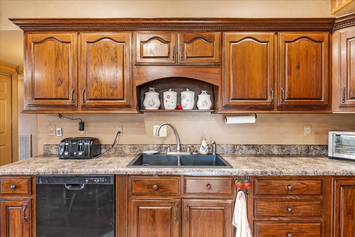 48 Mt Lebanon Road Lawrenceburg, TN 38464 - Photo 43 of 85 a kitchen with granite countertop a sink and cabinets