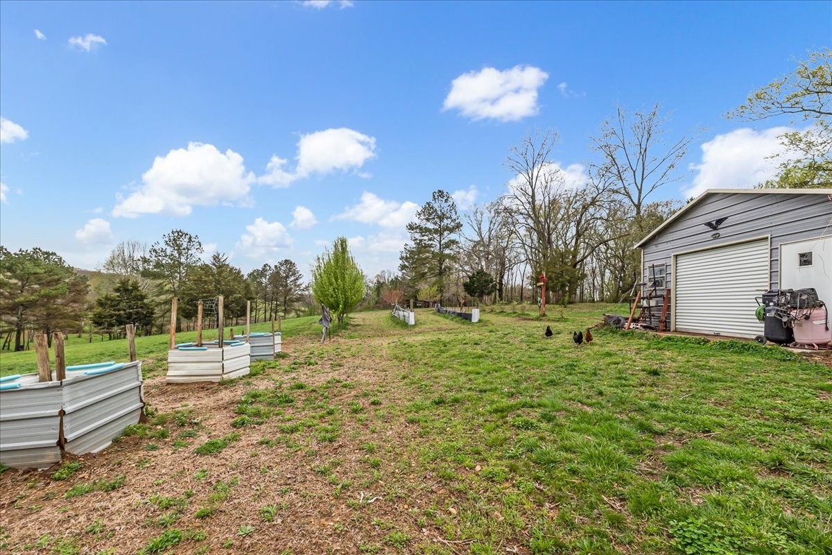 48 Mt Lebanon Road Lawrenceburg, TN 38464 - Photo 48 of 85 a backyard of a house with a yard and outdoor seating