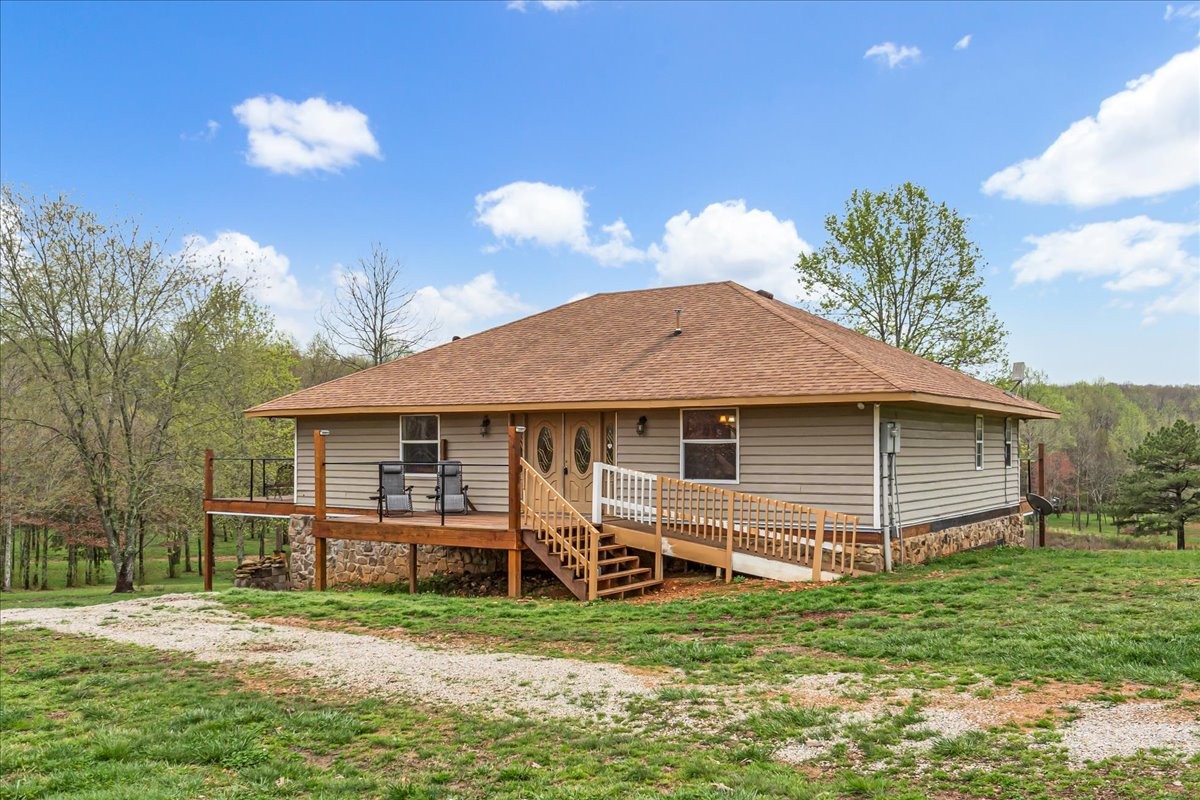 48 Mt Lebanon Road Lawrenceburg, TN 38464 - Photo 7 of 85 a backyard of a house with a garden and barbeque oven