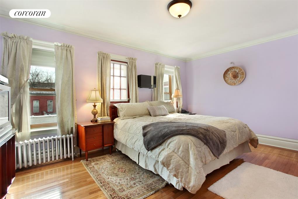 104 Rutland Road Brooklyn, NY 11225 - Photo 1 of 1 a bedroom with a bed and window