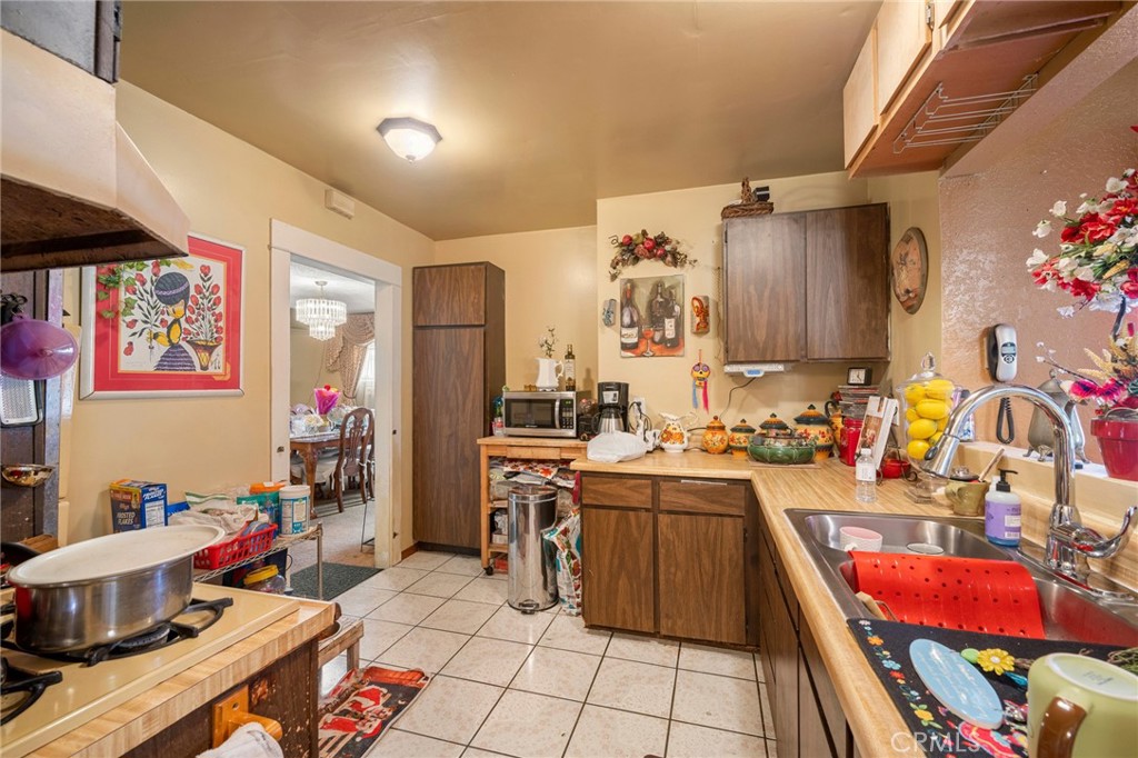 2161 Ridgeview Avenue Eagle Rock, CA 90041 - Photo 11 of 36 a kitchen that has a lot of cabinets a sink and a stove