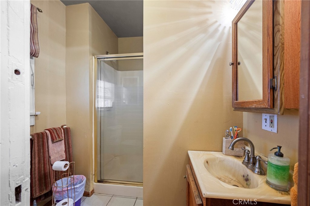 2161 Ridgeview Avenue Eagle Rock, CA 90041 - Photo 19 of 36 a bathroom with a sink toilet and shower