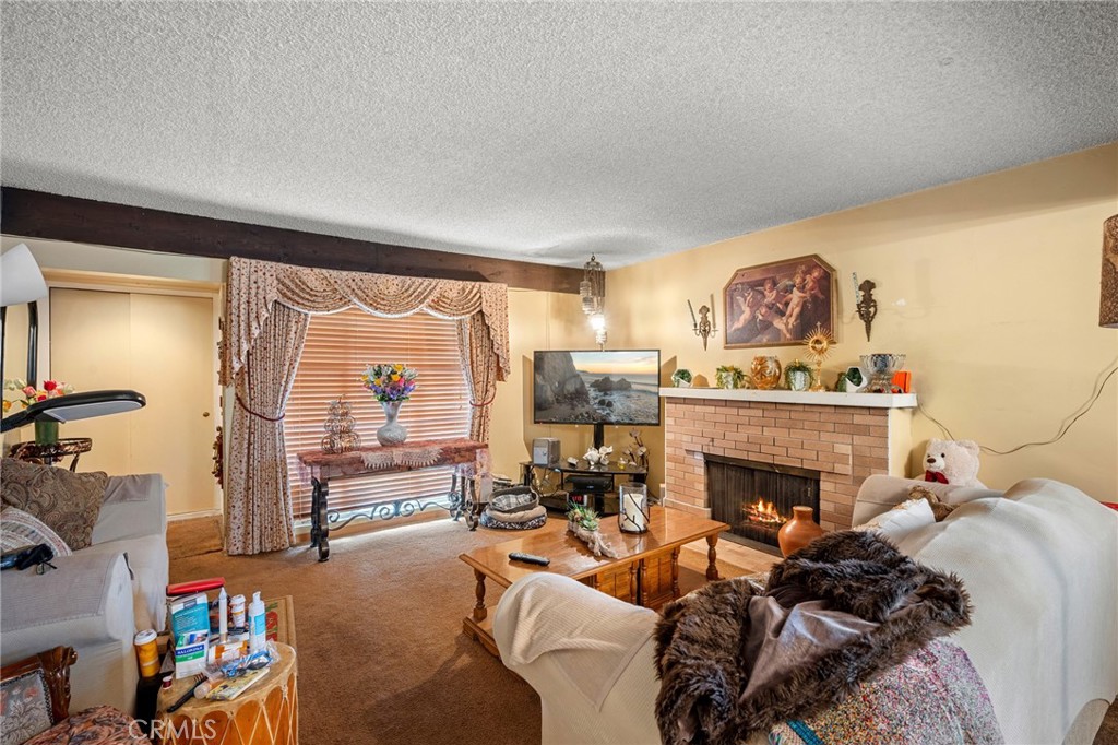 2161 Ridgeview Avenue Eagle Rock, CA 90041 - Photo 6 of 36 a living room with furniture and a fireplace