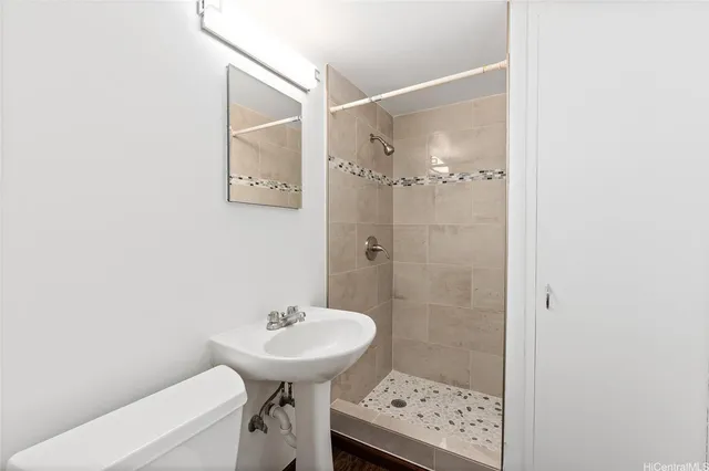 a view of hallway with wooden floor