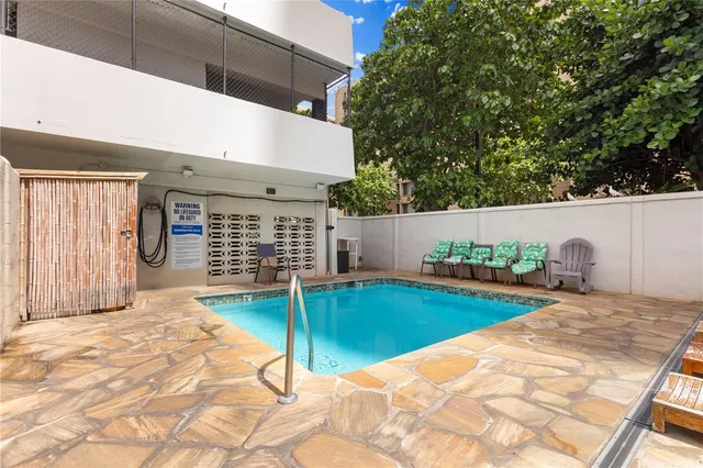 a view of a swimming pool with a patio