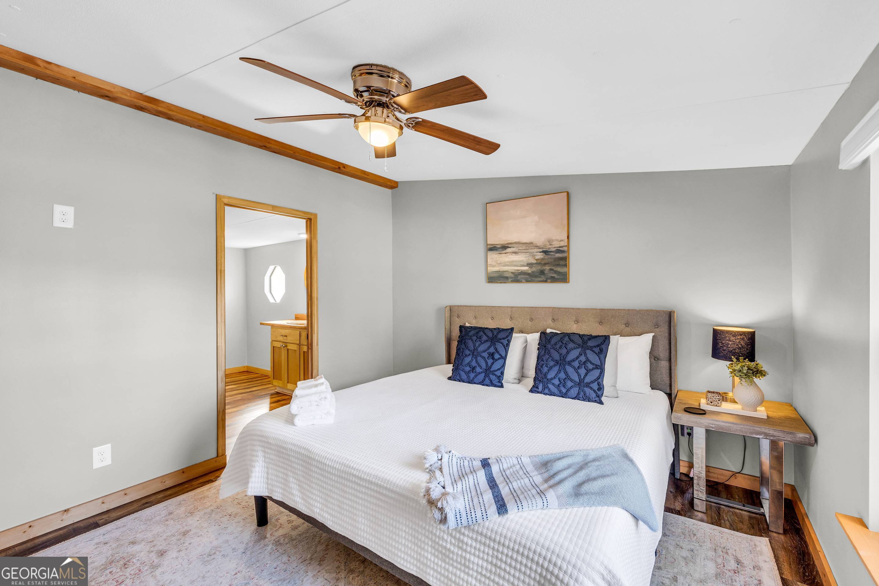 284 Duncan Bridge Road Sautee Nacoochee, GA 30571 - Photo 18 of 69 a bedroom with a bed and a chandelier
