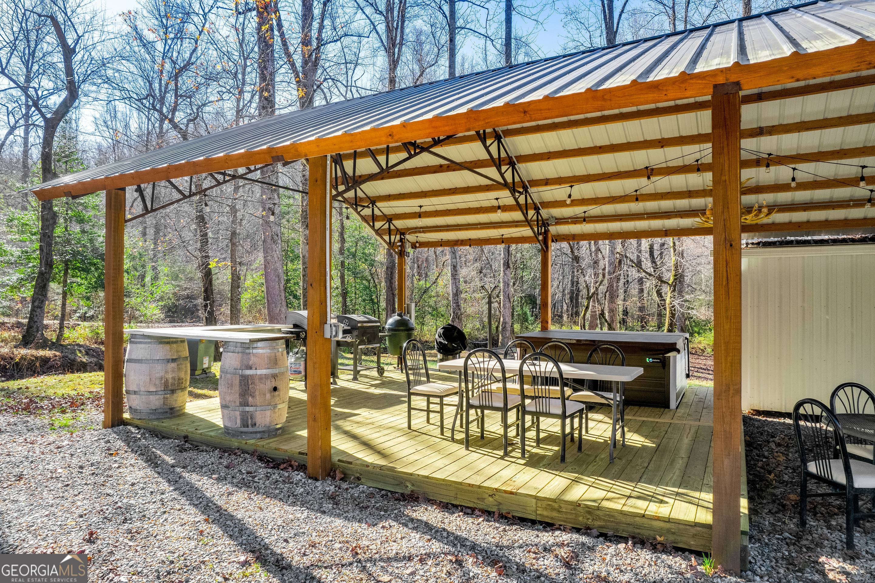 284 Duncan Bridge Road Sautee Nacoochee, GA 30571 - Photo 53 of 69 a view of a porch with a table and chairs