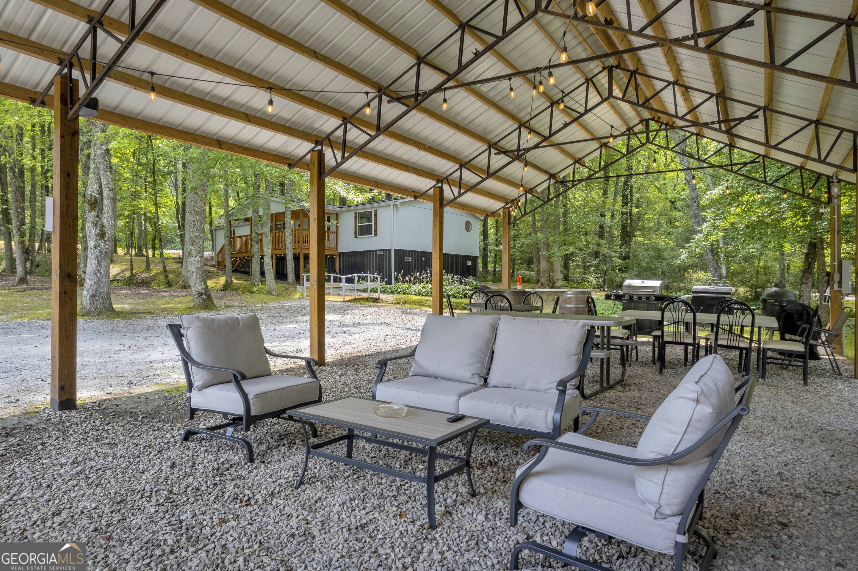 284 Duncan Bridge Road Sautee Nacoochee, GA 30571 - Photo 57 of 69 a outdoor living space with furniture and garden view