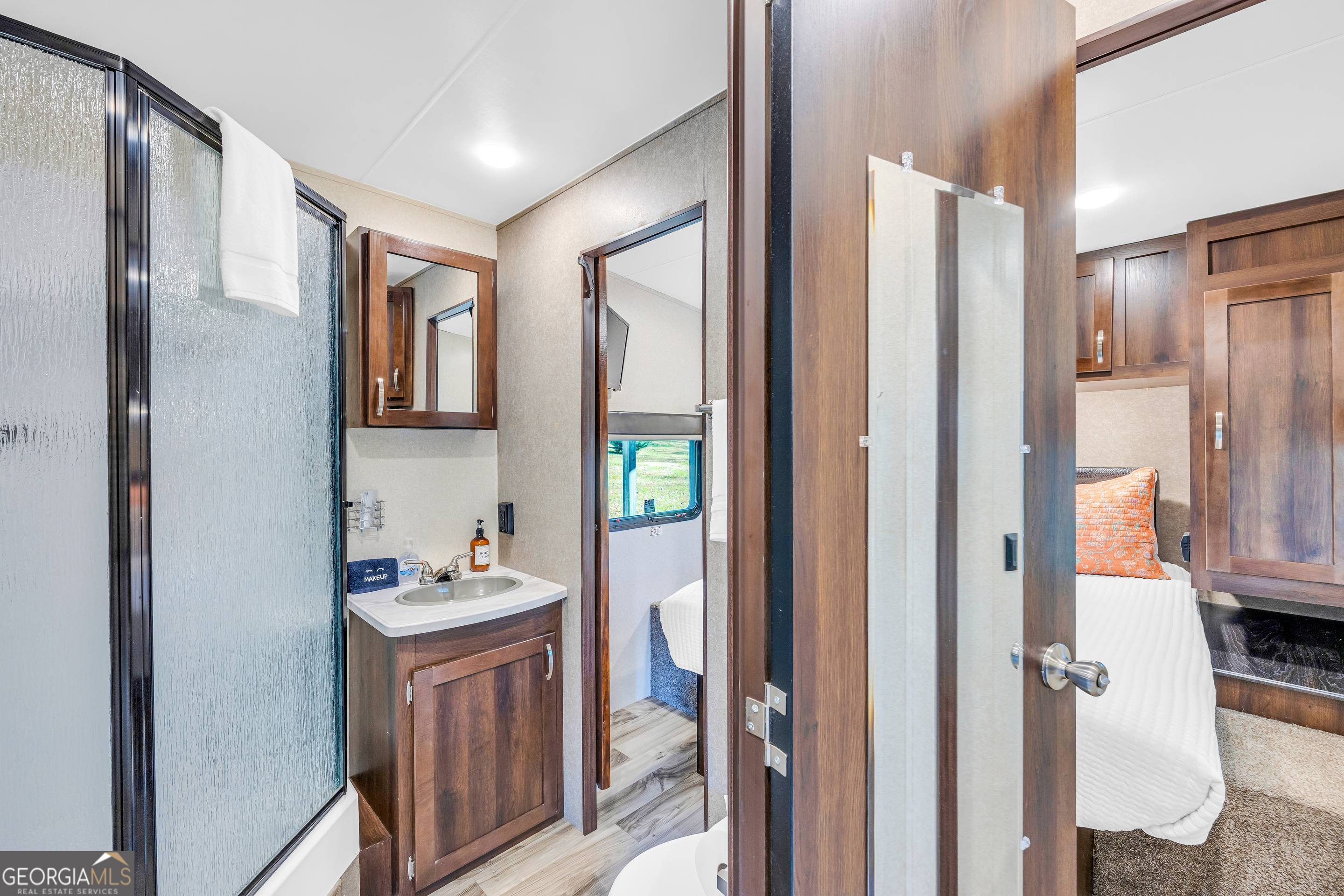 284 Duncan Bridge Road Sautee Nacoochee, GA 30571 - Photo 68 of 69 a bathroom with a double vanity sink and a mirror