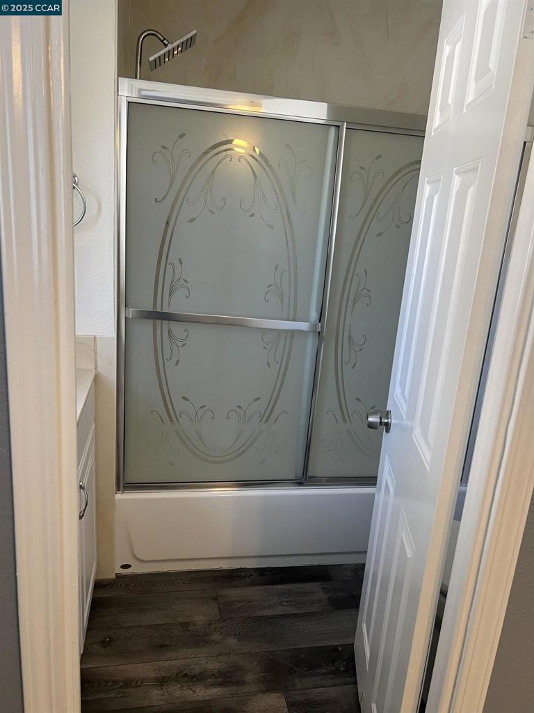 16711 Marsh Creek Road Clayton, CA 94517 - Photo 15 of 20 a bathroom with a glass shower door and a sink