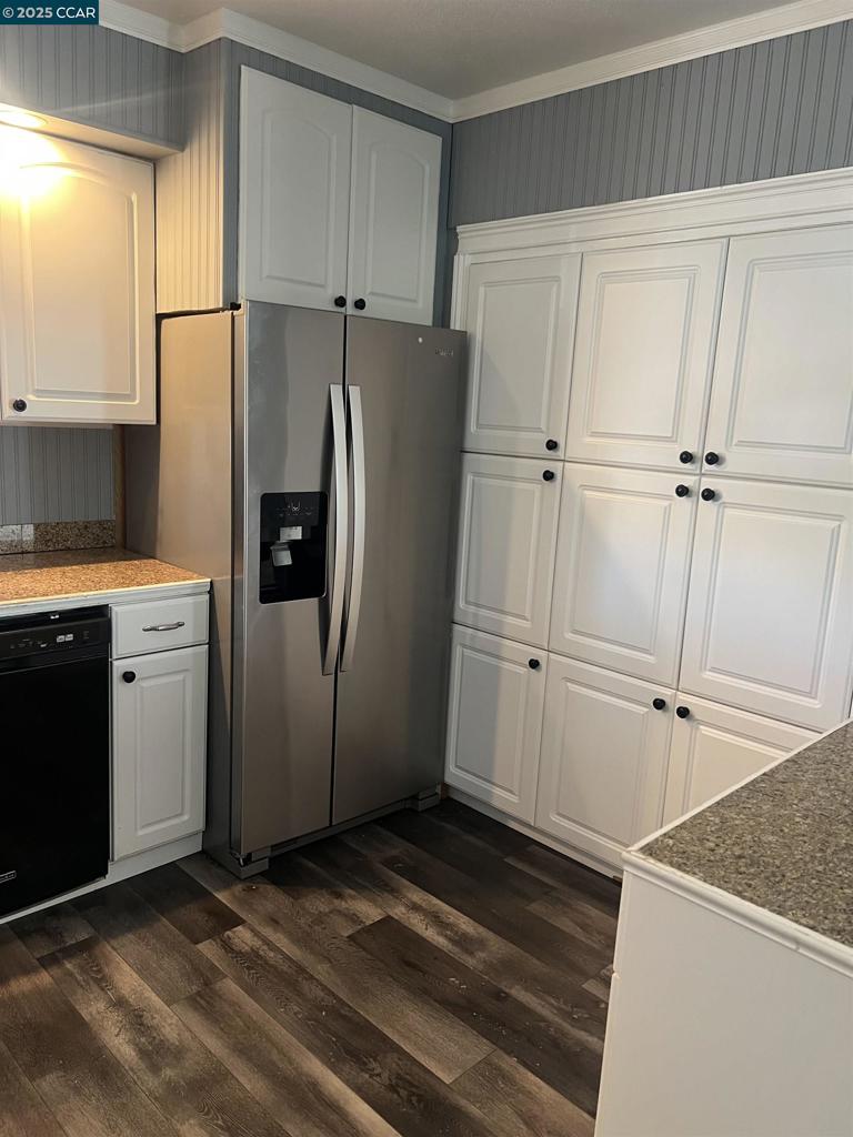 16711 Marsh Creek Road Clayton, CA 94517 - Photo 6 of 20 a kitchen with a refrigerator and cabinets