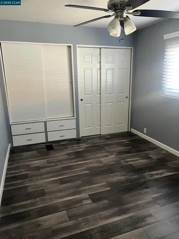 a view of a livingroom with a hardwood floor
