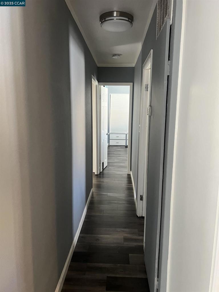 16711 Marsh Creek Road Clayton, CA 94517 - Photo 8 of 20 a view of a hallway with the wooden floor