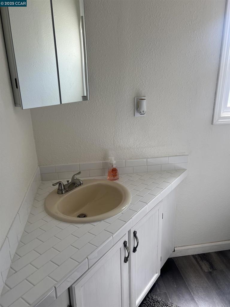 16711 Marsh Creek Road Clayton, CA 94517 - Photo 8 of 20 a bathroom with a sink and a mirror