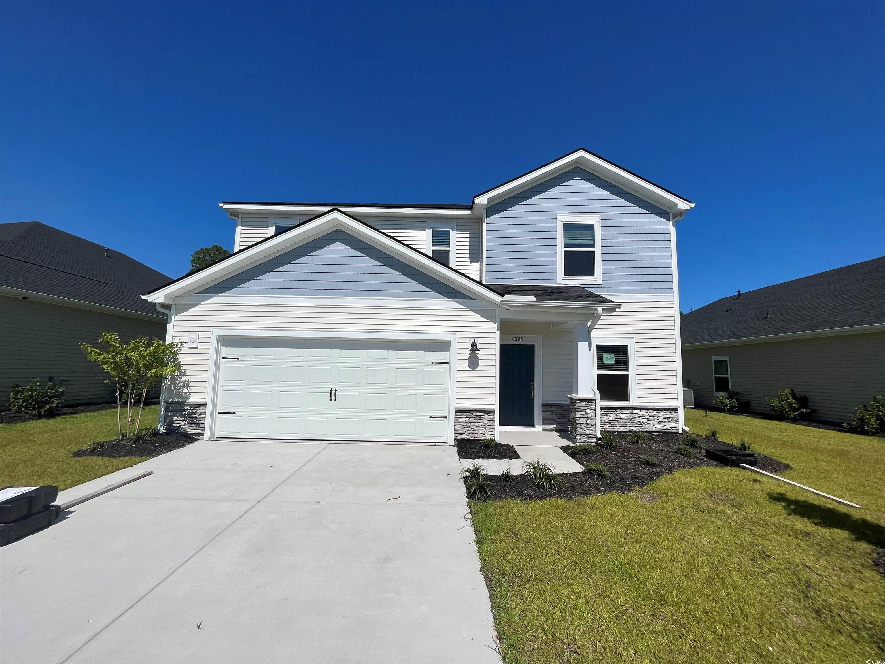 7089 Watercress Street Myrtle Beach, SC 29579 - Photo 1 of 23 View of front of property with a garage and a fron