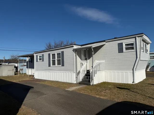 a front view of a house with a garage