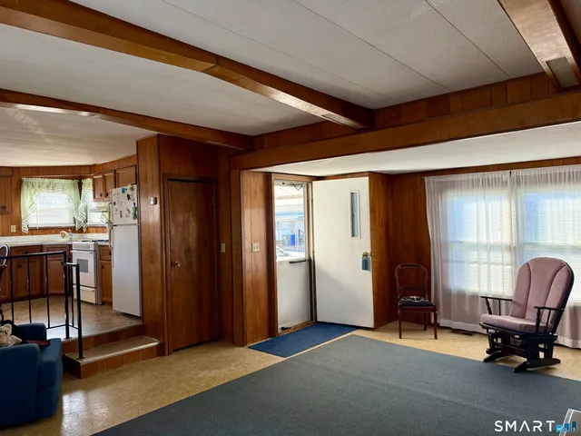 a view of a livingroom with couch and a window