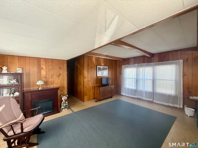 a view of a livingroom with furniture and windows