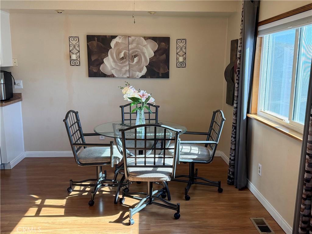 1550 Rimpau Avenue, Unit 138 Corona, CA 92881 - Photo 6 of 29 a view of a workspace with furniture and wooden floor